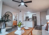 Thumbnail 1 of 37 - an open living room and kitchen with a ceiling fan