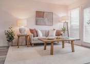 Thumbnail 4 of 37 - a living room with a ceiling fan and a couch