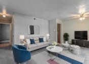 Thumbnail 1 of 13 - a living room with a couch and a table and a tv