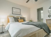 Thumbnail 5 of 37 - a bedroom with a large bed and a ceiling fan