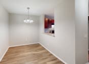 Thumbnail 10 of 20 - Dining room with light fixture