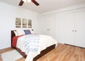 Thumbnail 15 of 16 - a bedroom with a bed and white closets