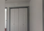 Thumbnail 14 of 43 - an open door with two white closet doors