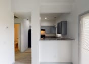 Thumbnail 40 of 43 - a view of a kitchen and a hallway with a door to a bathroom