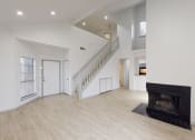 Thumbnail 34 of 43 - a large white room with a black fireplace and geometric shapes on the walls