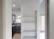 Thumbnail 35 of 43 - the closet in a small apartment with open shelving and a kitchen
