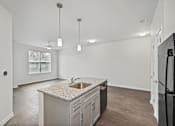 Thumbnail 10 of 29 - Three bedroom kitchen and living room at Village at Blenheim Run