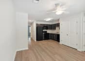 Thumbnail 21 of 39 - a renovated living room and kitchen in a new home