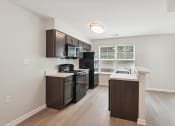Thumbnail 18 of 39 - kitchen with wood flooring
