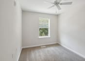 Thumbnail 33 of 39 - bedroom with small window and ceiling fan