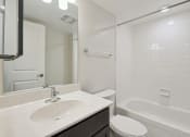 Thumbnail 34 of 39 - bathroom vanity tub and toilet