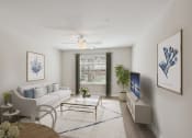 Thumbnail 11 of 19 - a living room with a white couch and a table