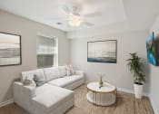 Thumbnail 8 of 39 - a living room with a couch and a coffee table