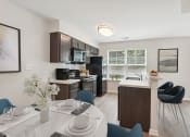 Thumbnail 1 of 39 - a kitchen and dining room with a white table and chairs and a black