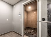 Thumbnail 14 of 18 - a bathroom with a shower and a sliding glass door