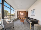 Thumbnail 2 of 26 - a living room with couches chairs and a coffee table in front of a large window