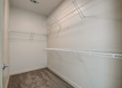 Thumbnail 21 of 26 - a spacious walk in closet at the historic electric building in fort worth, tx