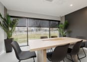 Thumbnail 11 of 28 - a dining room with a table and chairs in front of a window