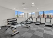 Thumbnail 6 of 16 - the gym with treadmills and weights at the belgard apartments