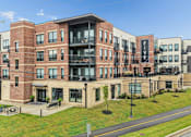 Thumbnail 2 of 31 - Apartment complex with the name Five on the side.