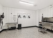 Thumbnail 12 of 31 - A room with a wallpapered wall and a sink.