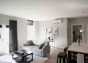 Thumbnail 26 of 28 - living room and kitcen with grey couch and island