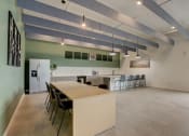 Thumbnail 4 of 30 - a kitchen and dining room with a long table and chairs