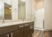 Thumbnail 4 of 33 - a bathroom with two sinks and a shower