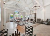 Thumbnail 15 of 24 - a large living room with chairs and a table