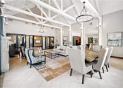 Thumbnail 16 of 24 - a large living room with a dining room table and chairs