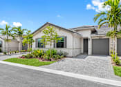 Thumbnail 1 of 35 - a house with a driveway and a garage door