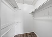 Thumbnail 13 of 21 - A white wall with a switch and a light fixture.