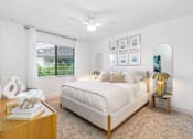 Thumbnail 7 of 35 - a white bedroom with a bed and a window