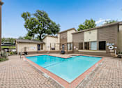 Thumbnail 15 of 21 - A small pool surrounded by a brick patio.