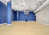 Thumbnail 20 of 22 - a large room with a hard wood floor and blue walls