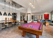 Thumbnail 46 of 95 - Germantown Nashville Luxury Apartments for Rent - Peyton Stakes - Clubhouse with Billiards Table, Kitchen Area, and Floor-to-Ceiling Windows