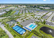 Thumbnail 17 of 35 - an aerial view of a city with buildings and a pool