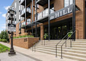 Thumbnail 26 of 41 - A building with a sign that says Hill on it.