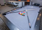 Thumbnail 23 of 33 - a pool table with a bunch of billiard balls on it
