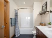 Thumbnail 45 of 45 - a bathroom with a shower and a sink and a toilet at Verge Apartments in St. Louis Park, MN