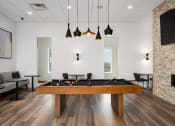 Thumbnail 13 of 45 - a games room with a pool table and a tv at Verge Apartments in St. Louis Park, MN