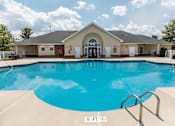 Thumbnail 45 of 64 - A large swimming pool in front of a building with a sign that says 5 ft.