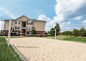 Thumbnail 52 of 64 - A sandy area in front of a two-story building.