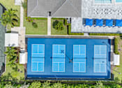 Thumbnail 33 of 35 - a birds eye view of the pool of a house with a tennis court