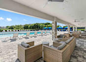 Thumbnail 19 of 35 - a pool with lounge chairs and tables at a resort