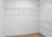 Thumbnail 30 of 61 - Empty white shelves in a room.