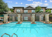 Thumbnail 1 of 48 - a swimming pool with a house in the background