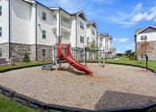 Thumbnail 25 of 36 - the preserve at ballantyne commons playground with a red slide