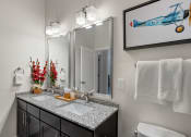 Thumbnail 80 of 95 - a bathroom with a vanity with two sinks and a mirror