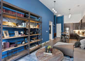Thumbnail 85 of 95 - a living room with blue walls and a kitchen with a table